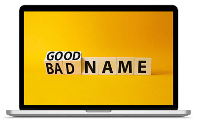 Su il monitor di un computer laptop è visualizzata una scritta nera "GoodName" su sfondo giallo