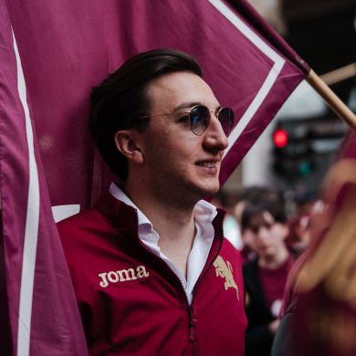 Matteo Possamai with the Torino FC flag.