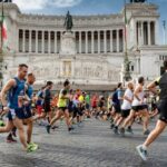 marathon runners in front of the altar of the homeland