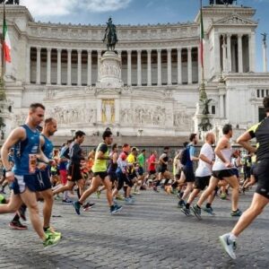 marathon runners in front of the altar of the homeland
