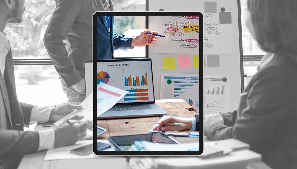 un team di persone sta analizzando dei documenti durante una riunione