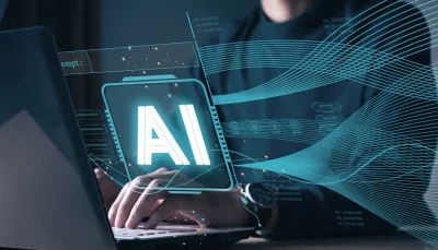 un uomo scrive al computer, in sovra impressione la scritta AI che rappresenta i diversi modelli di intelligenza artificiale